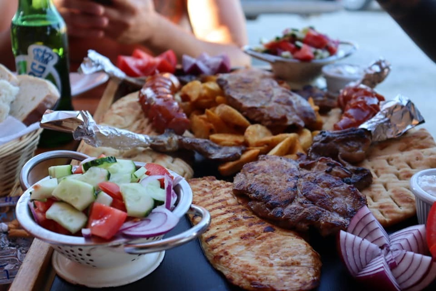 Grilled meats, pita, veggie platter at La Canapele, Vama Veche.