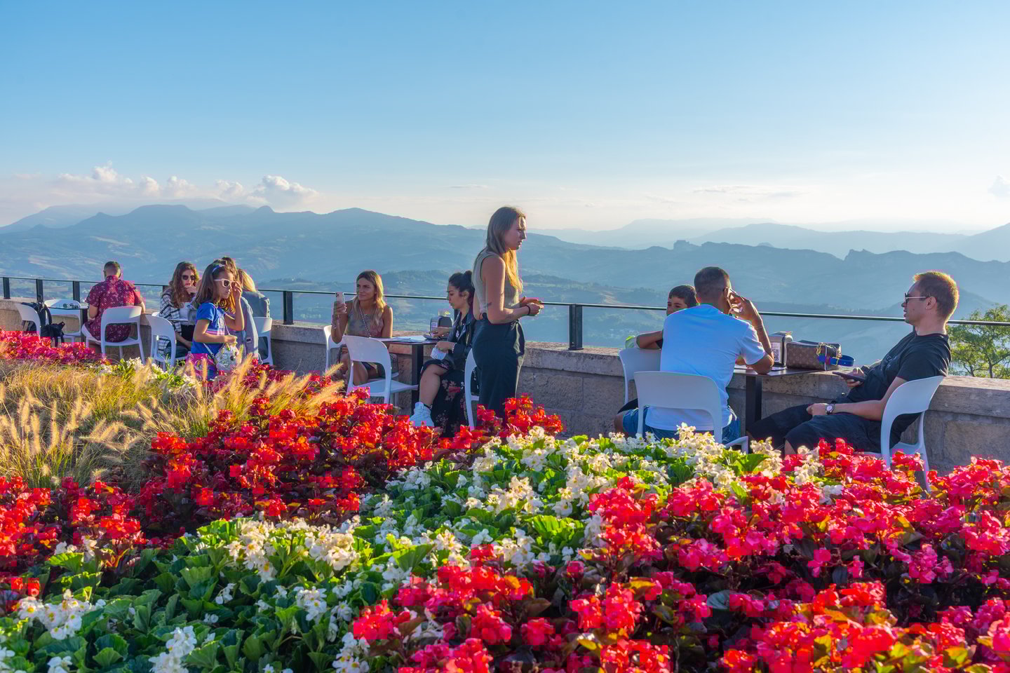 People relaxing on a terrace at a restaurant in San Marino