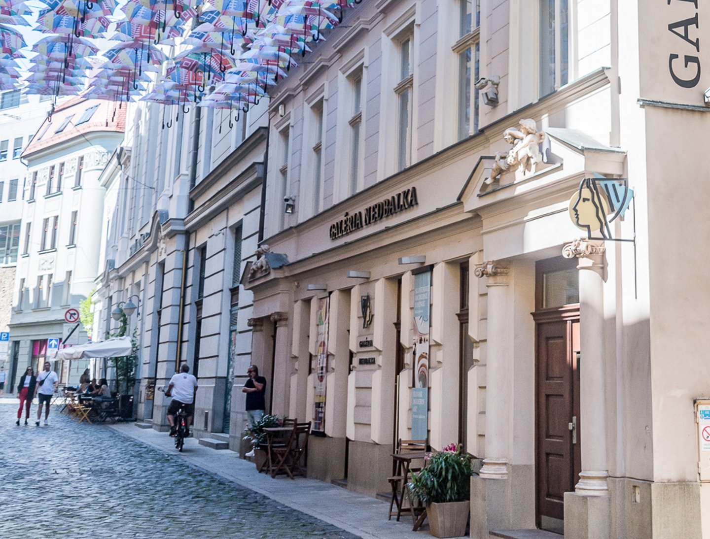 The entrance to Gallery Nedbalka with umbrellas hanging overhead