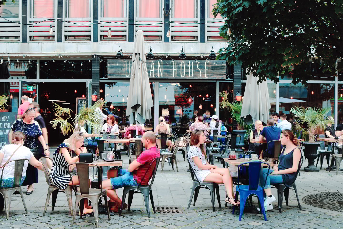 People sitting outside a cafe in Laurinska Street, Bratislava