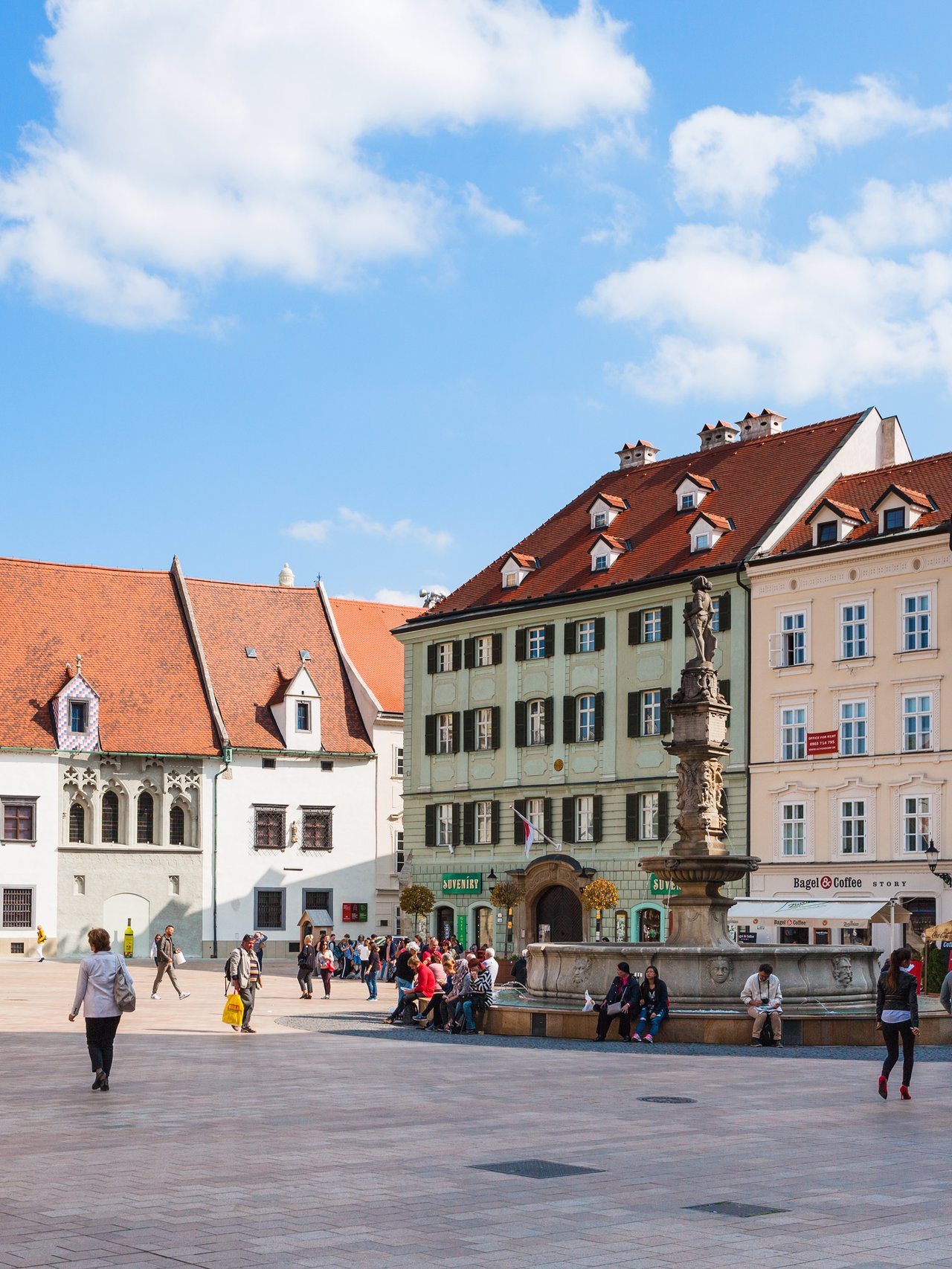 People milling around the Main Square in Bratislava, Slovakia
