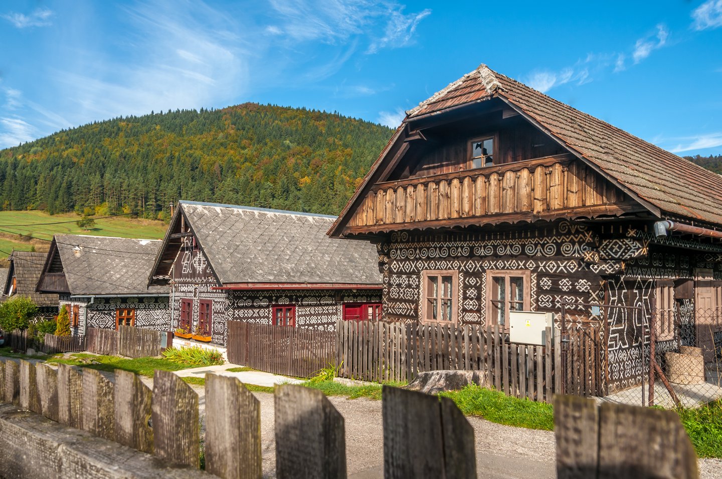 Decorated log houses line the street in Čičmany, Slovakia