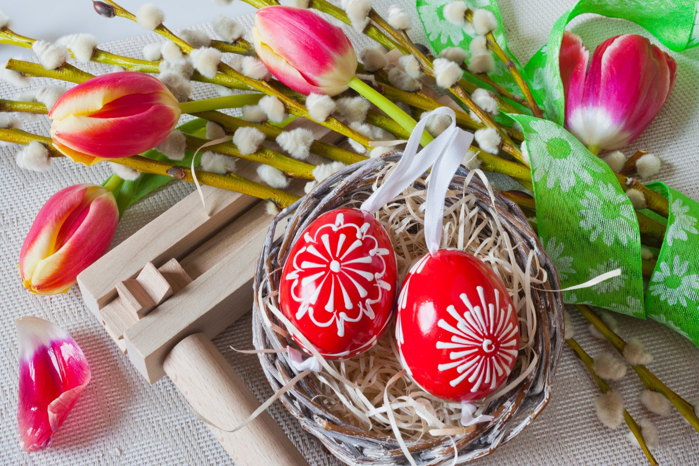 Painted eggs with pussywillow sprigs and colourful tulips