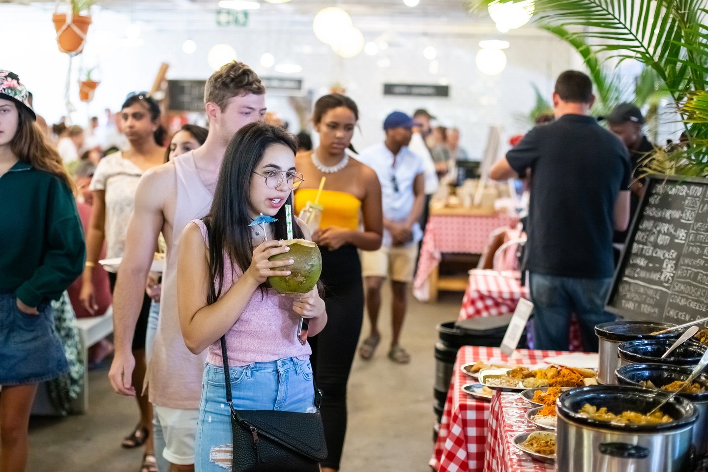 People looking at the food available at the Neighbourgoods Market in Johannesburg.