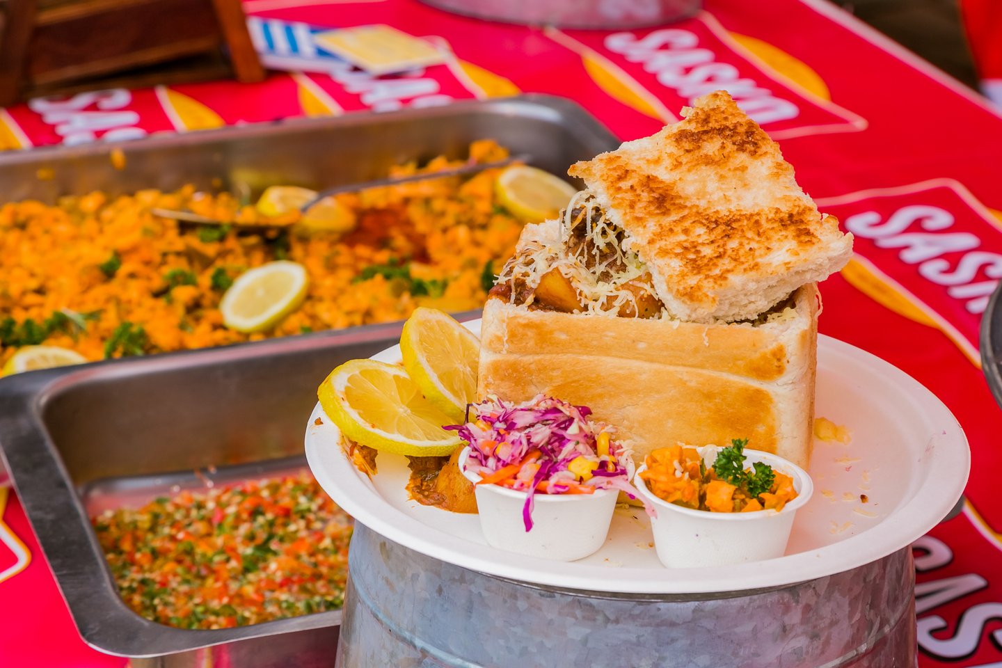 Bunny Chow, a traditional bread-based street food at an outdoor festival in Soweto.