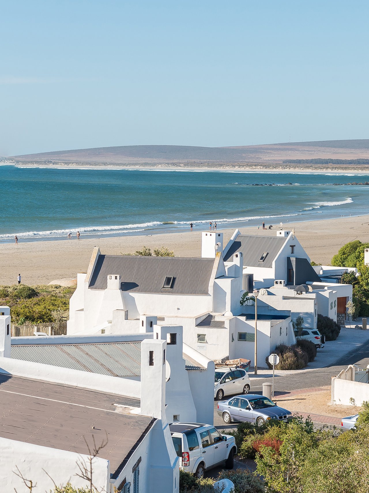White houses on the beach in Paternoster, South Africa.