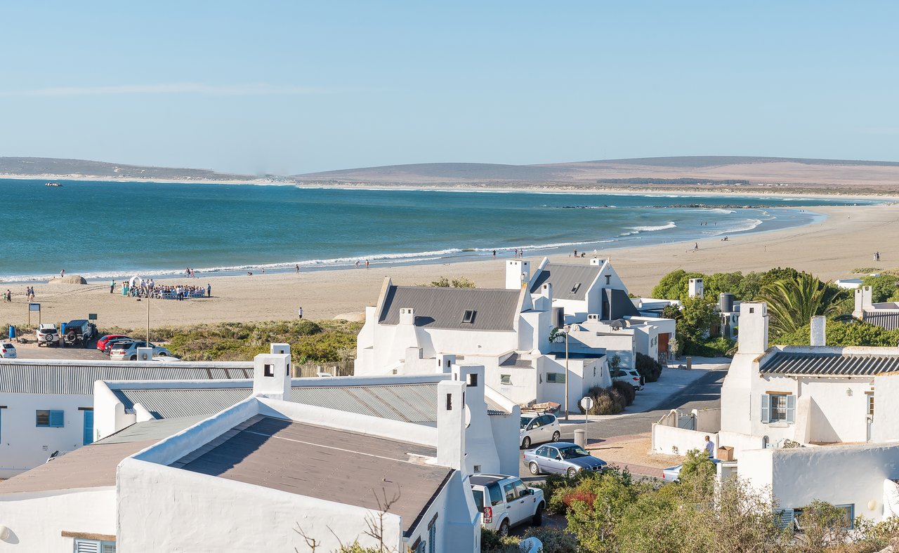 White houses on the beach in Paternoster, South Africa.