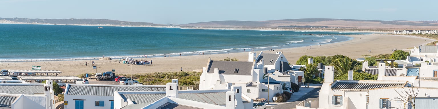 White houses on the beach in Paternoster, South Africa.