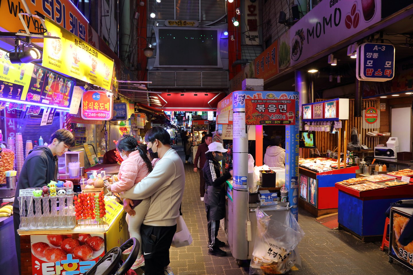 Vendors sell Korean food at famous Bupyeong Market in downtown Busan, South Korea.
