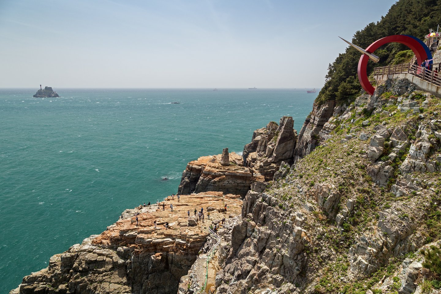 View of Sinseon Rock, rocky and steep cliff and ocean at the Taejongdae Resort Park in Busan, South Korea.