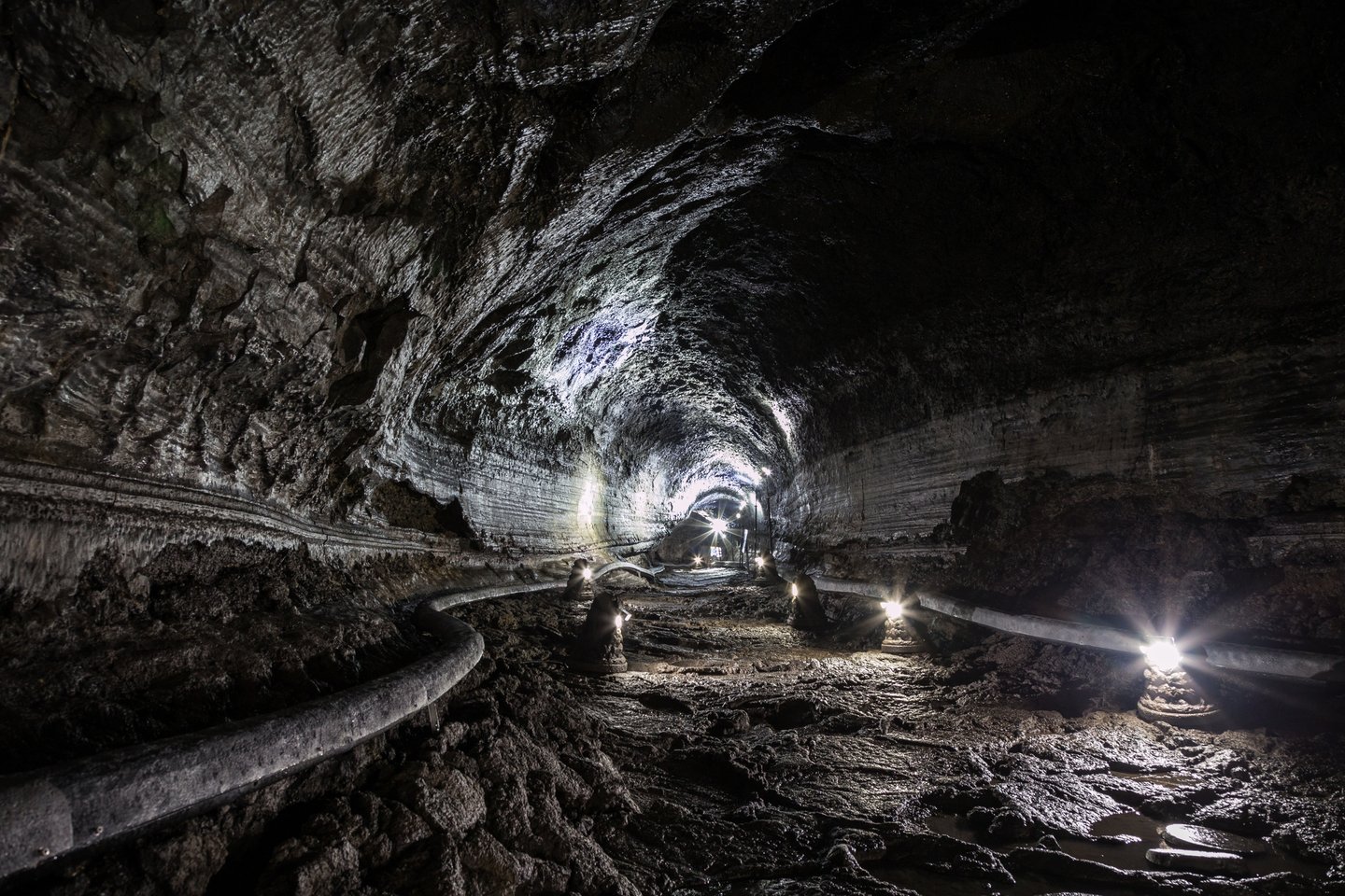 The empty, dimly-lit Manjanggul Lava Tube Cave on Jeju Island in South Korea.