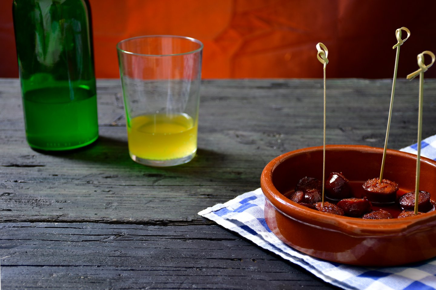 Asturian cider accompanying a dish of tapas