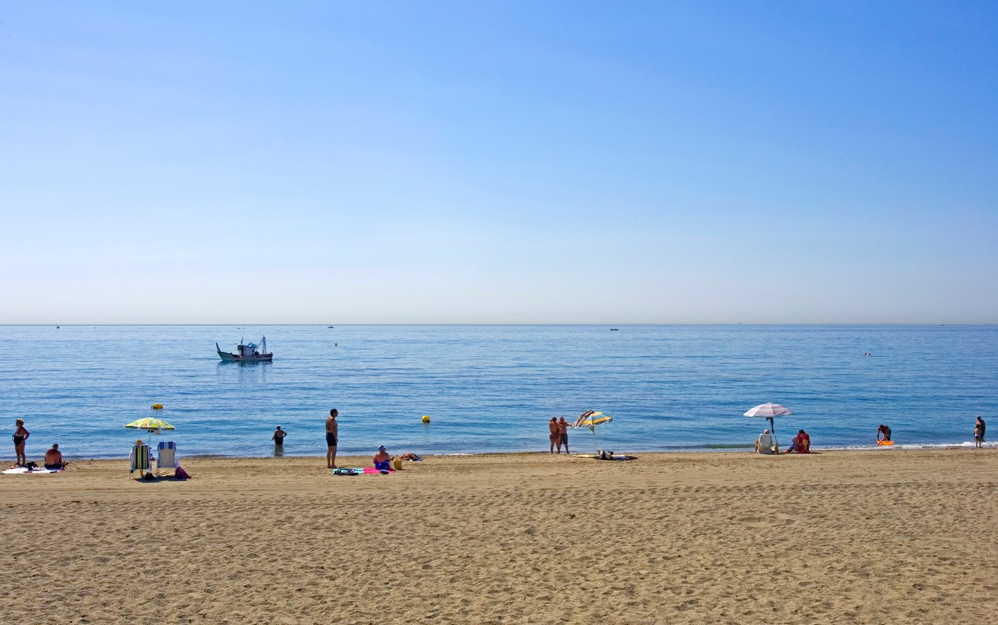 People on the beach at Estepona on a sunny day