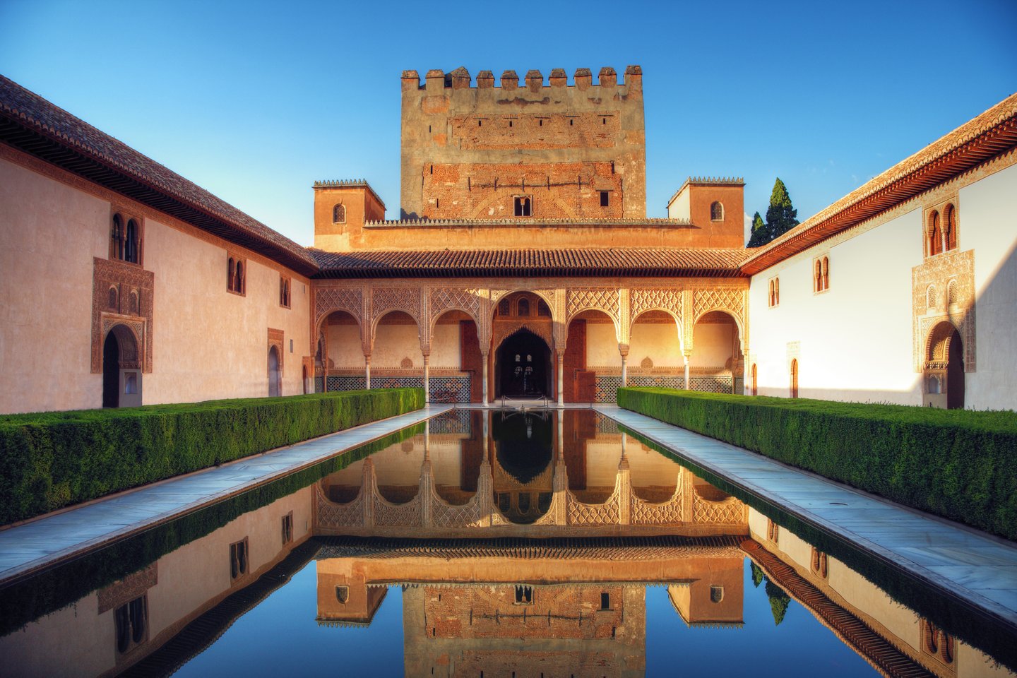 Reflections in a pool in the Praca al Mutamid in the Alhambra, Spain.