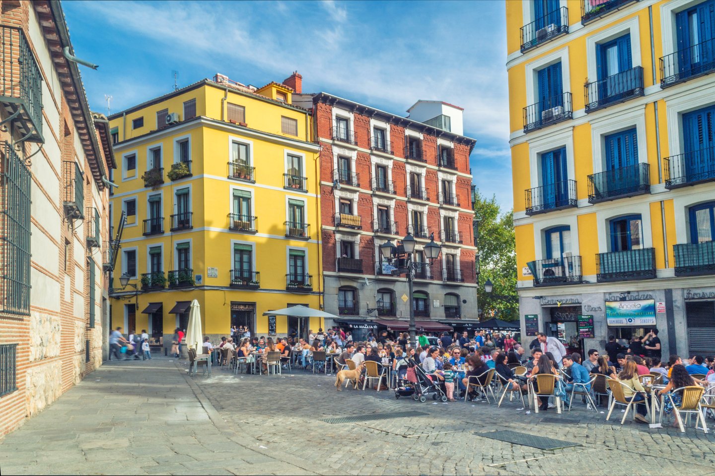 Outdoor dining and colourful buildings in La Latina, Madrid