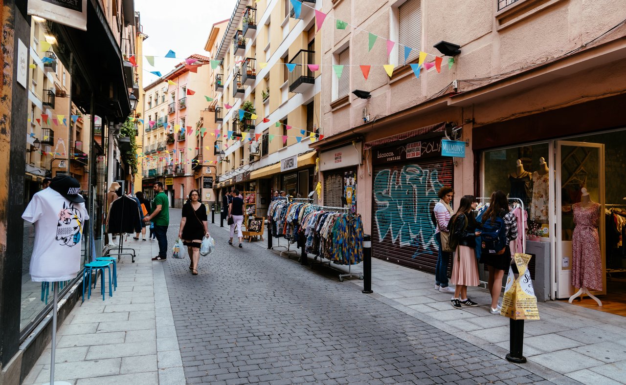 A flea market along a street in Lavapiés, Madrid