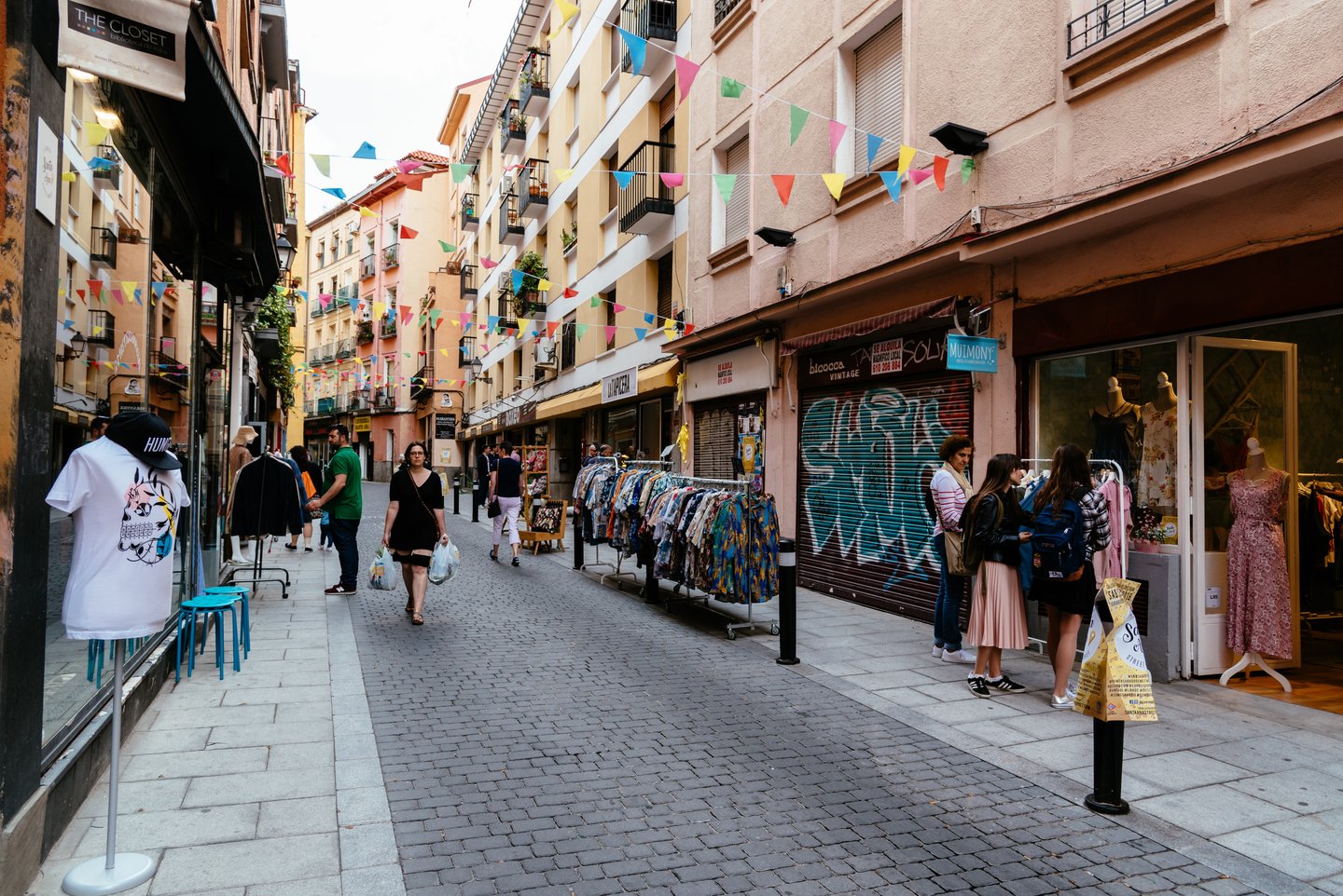 A flea market along a street in Lavapiés, Madrid