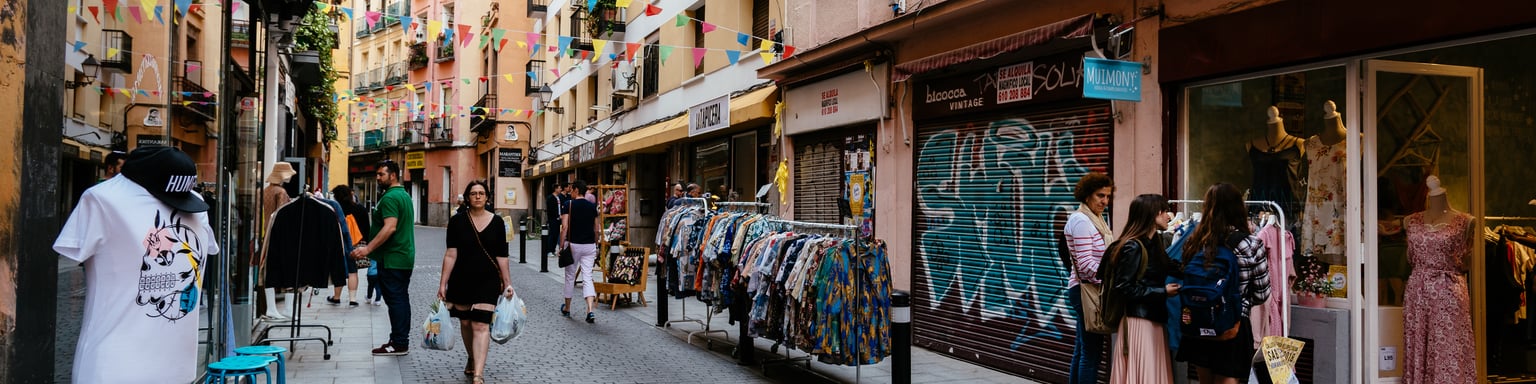 A flea market along a street in Lavapiés, Madrid
