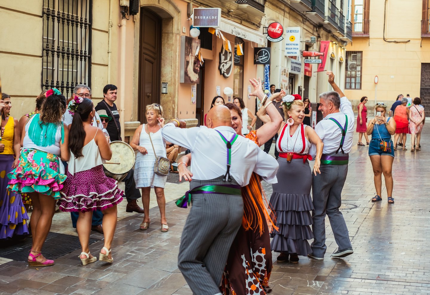 People dancing in the street during the Feria de Malaga