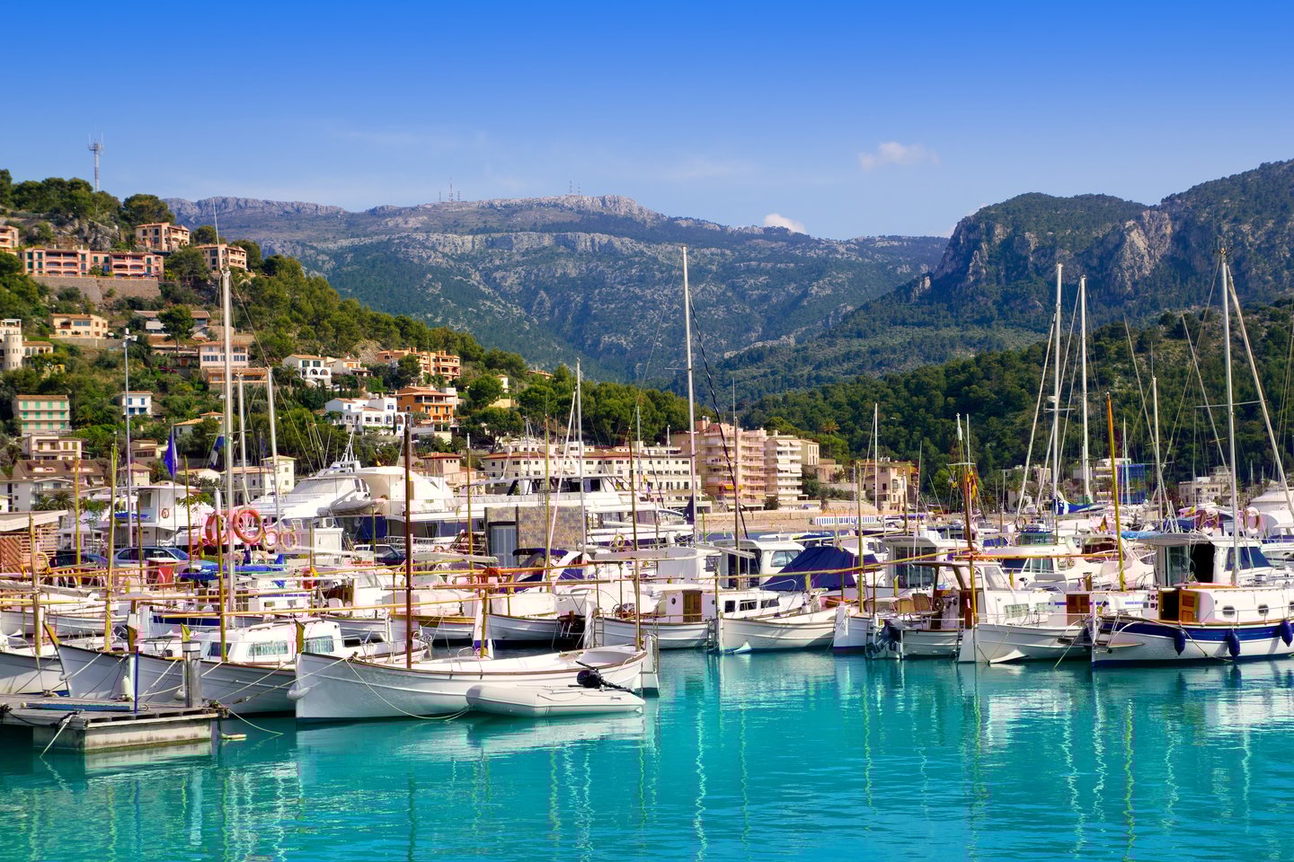 The coastal town of Port de Sóller with mountains in the background