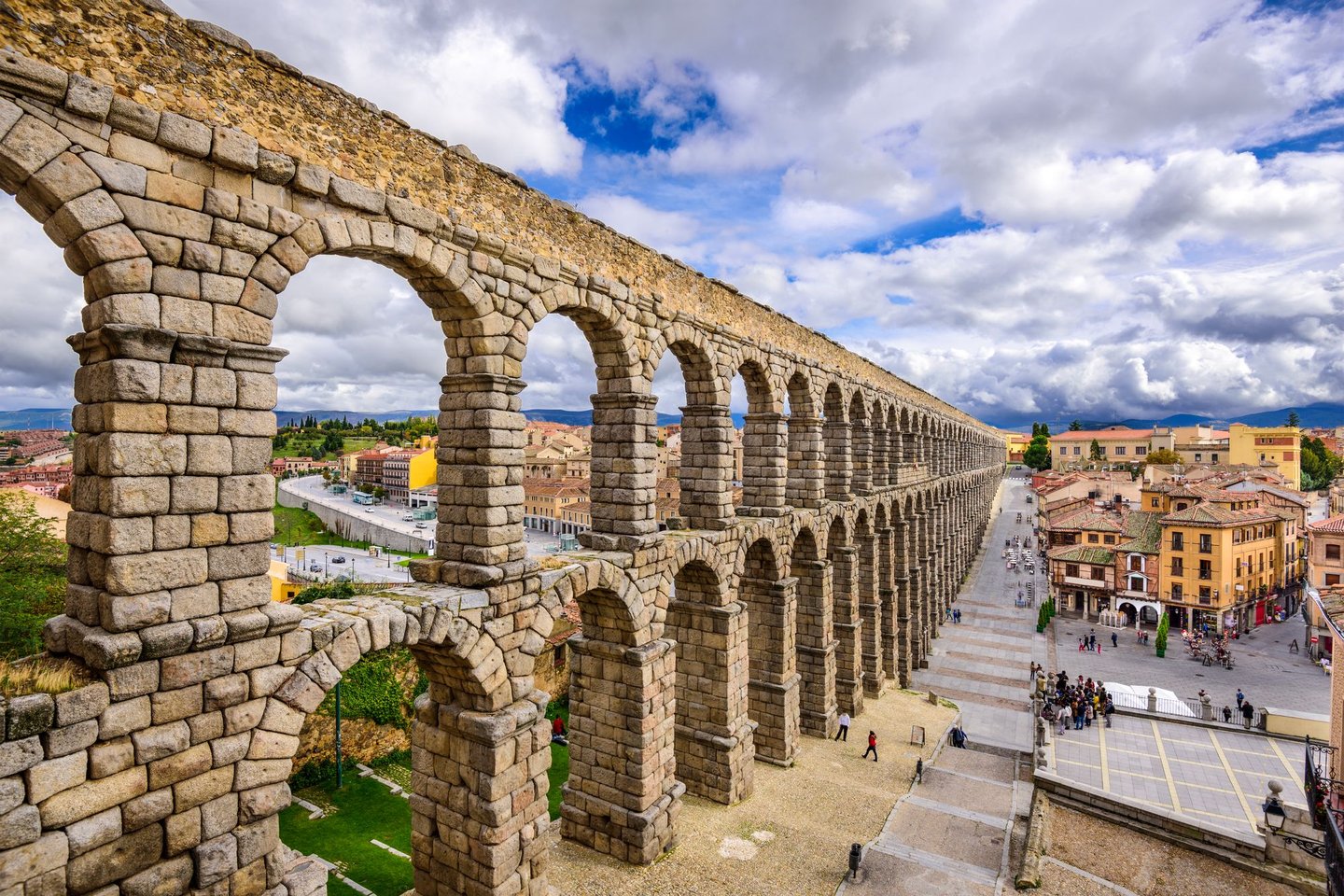 The famous aqueduct of Segovia with the old town in the background.