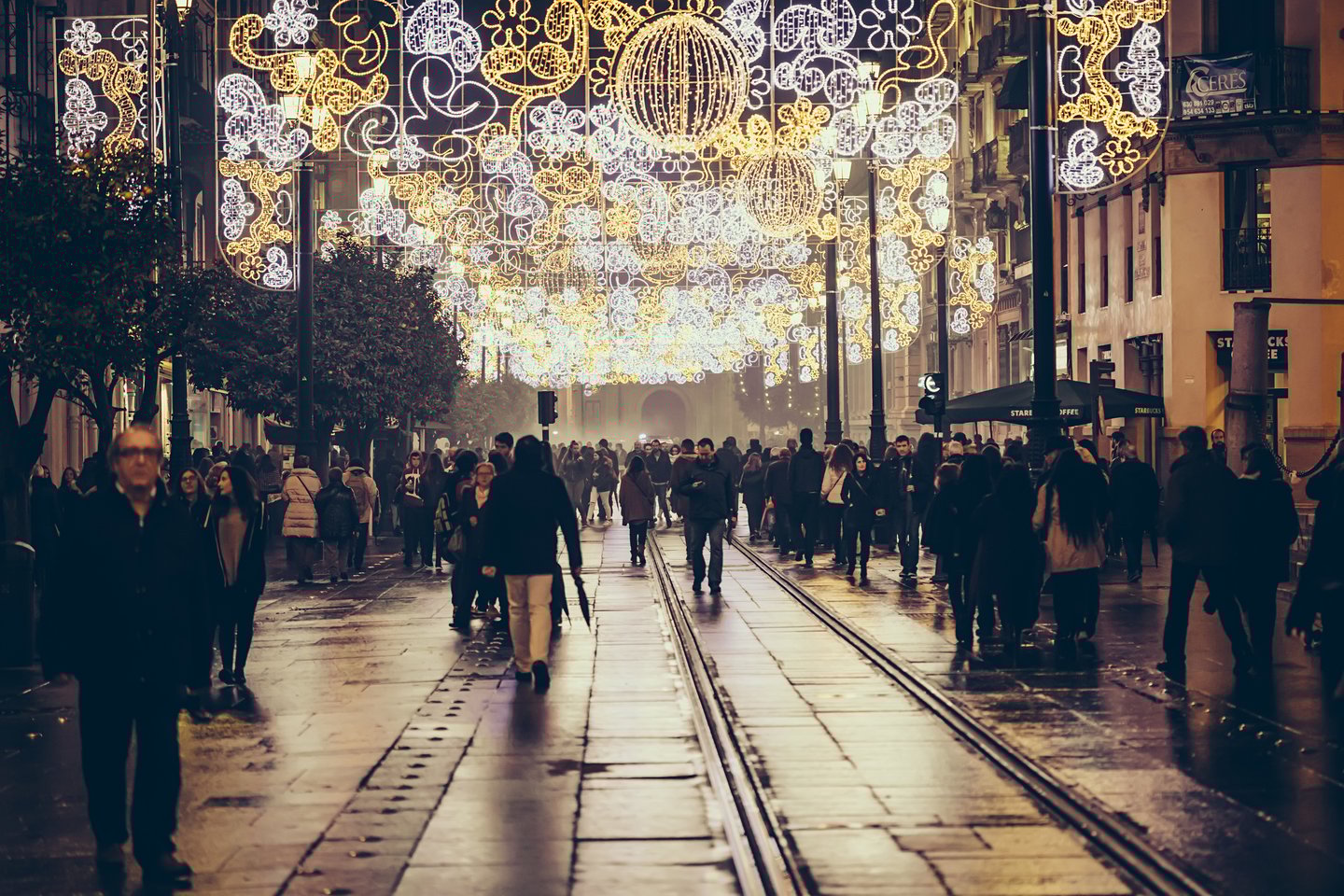 People walking around the Historical centre of Seville on Christmas night