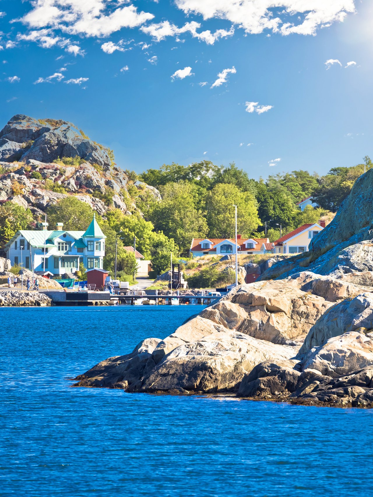 Houses and trees on the coastline of Brännö Island in Gothenburg Archipelago