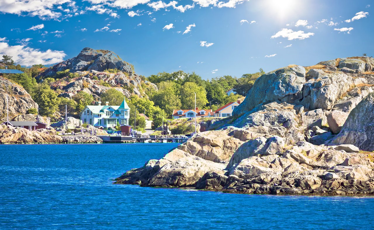 Houses and trees on the coastline of Brännö Island in Gothenburg Archipelago