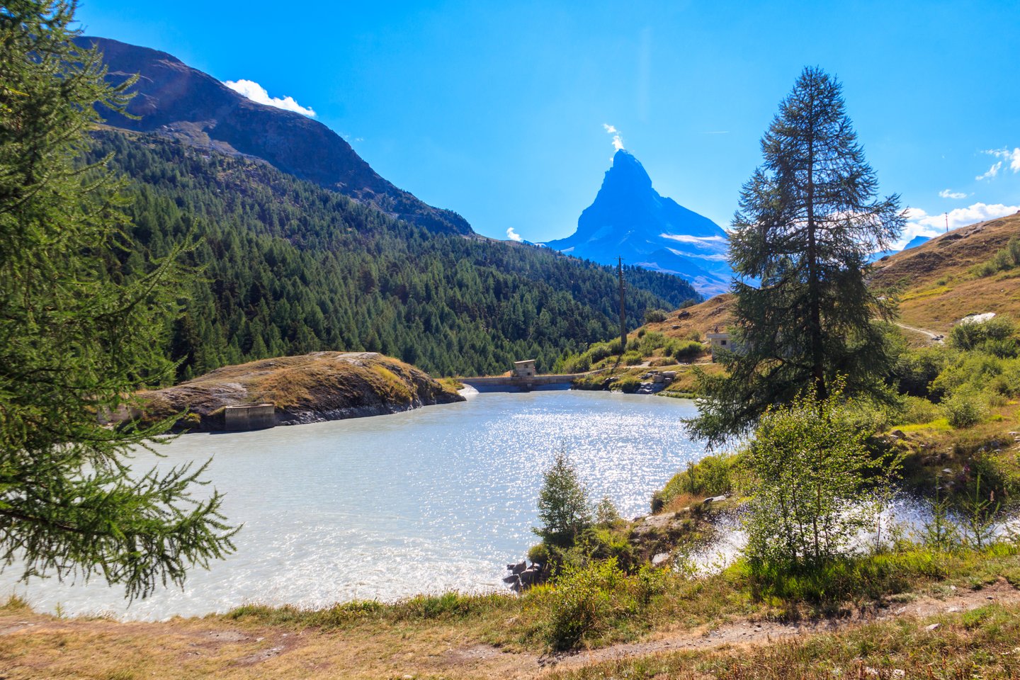 Moosjisee Lake in summer with the Matterhorn in the distance