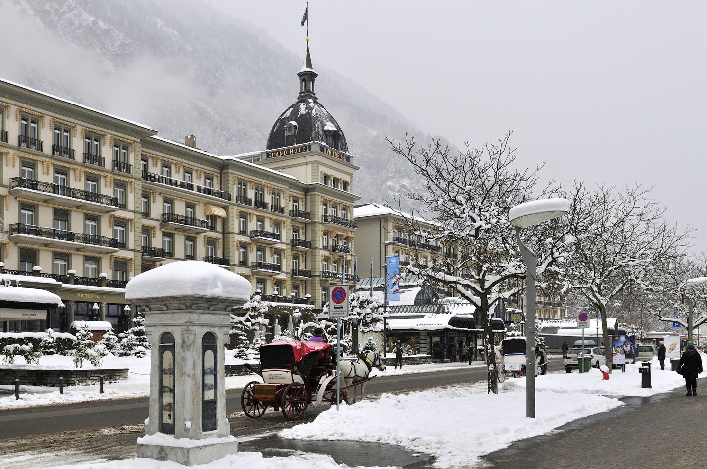A carriage in a snowy scene in Interlaken, Switzerland