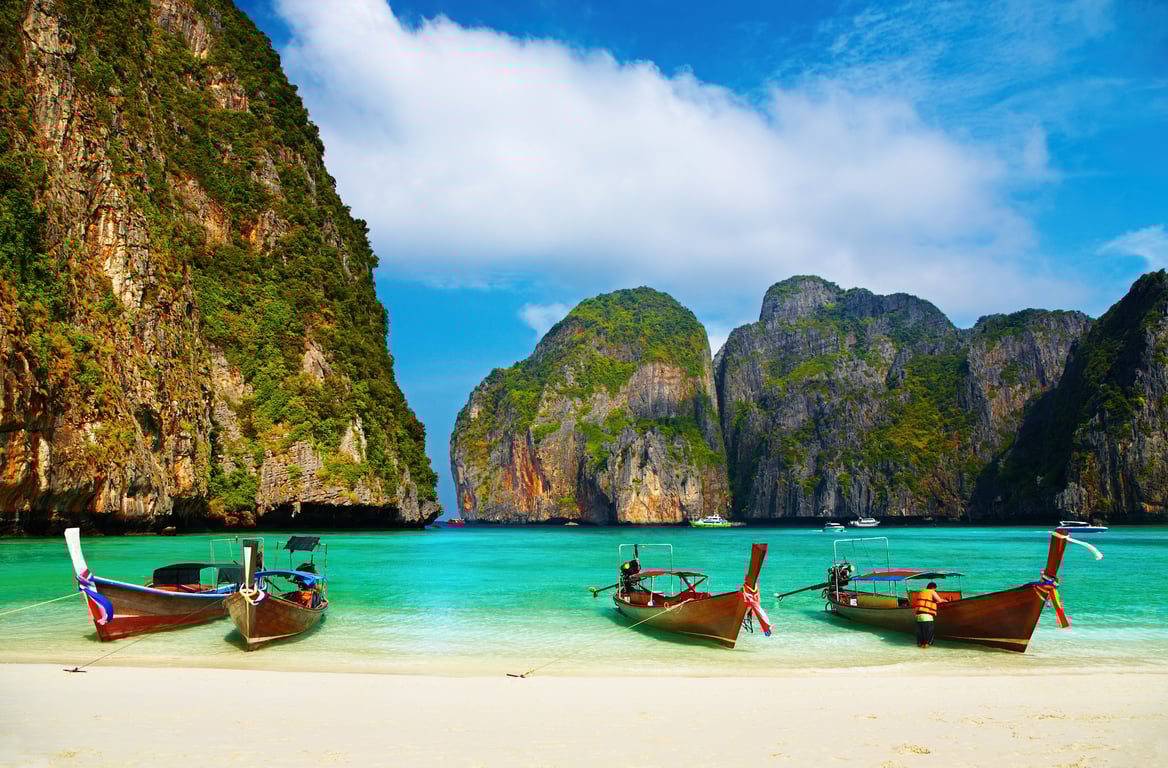 Long boats on the beach at Maya Bay in Thailand