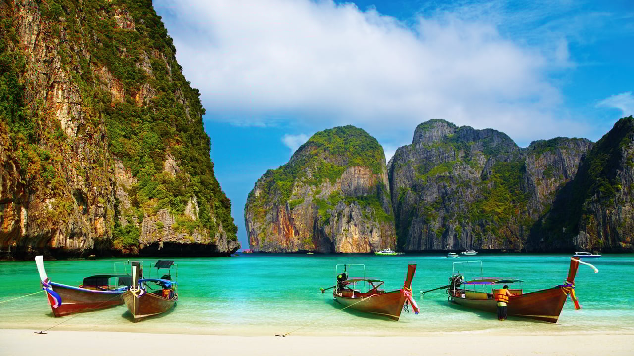 Long boats on the beach at Maya Bay in Thailand