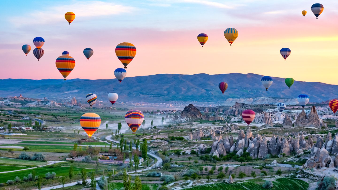 Balloons over Cappadocia at sunrise