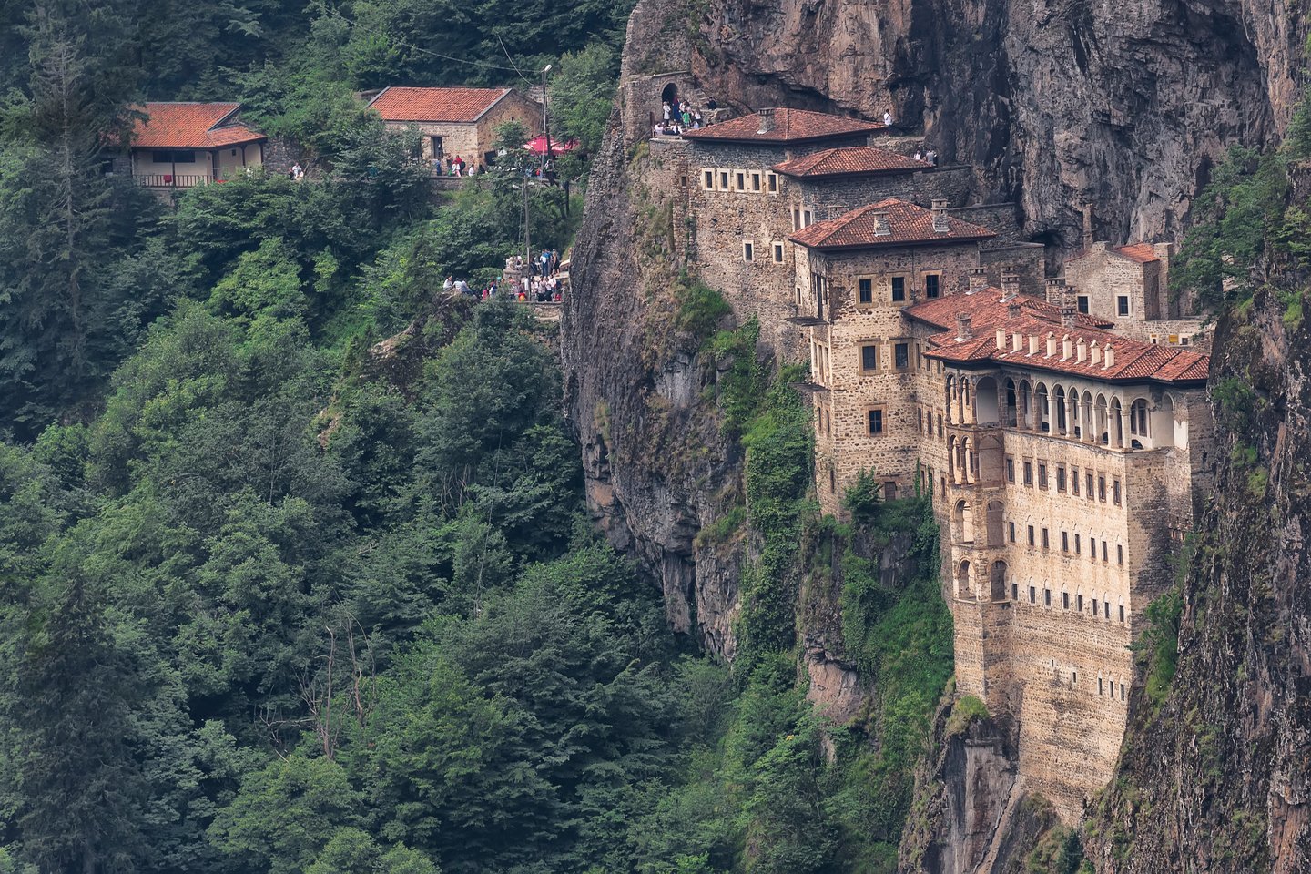 Sumela Monastery perched on a cliff and surrounded by trees