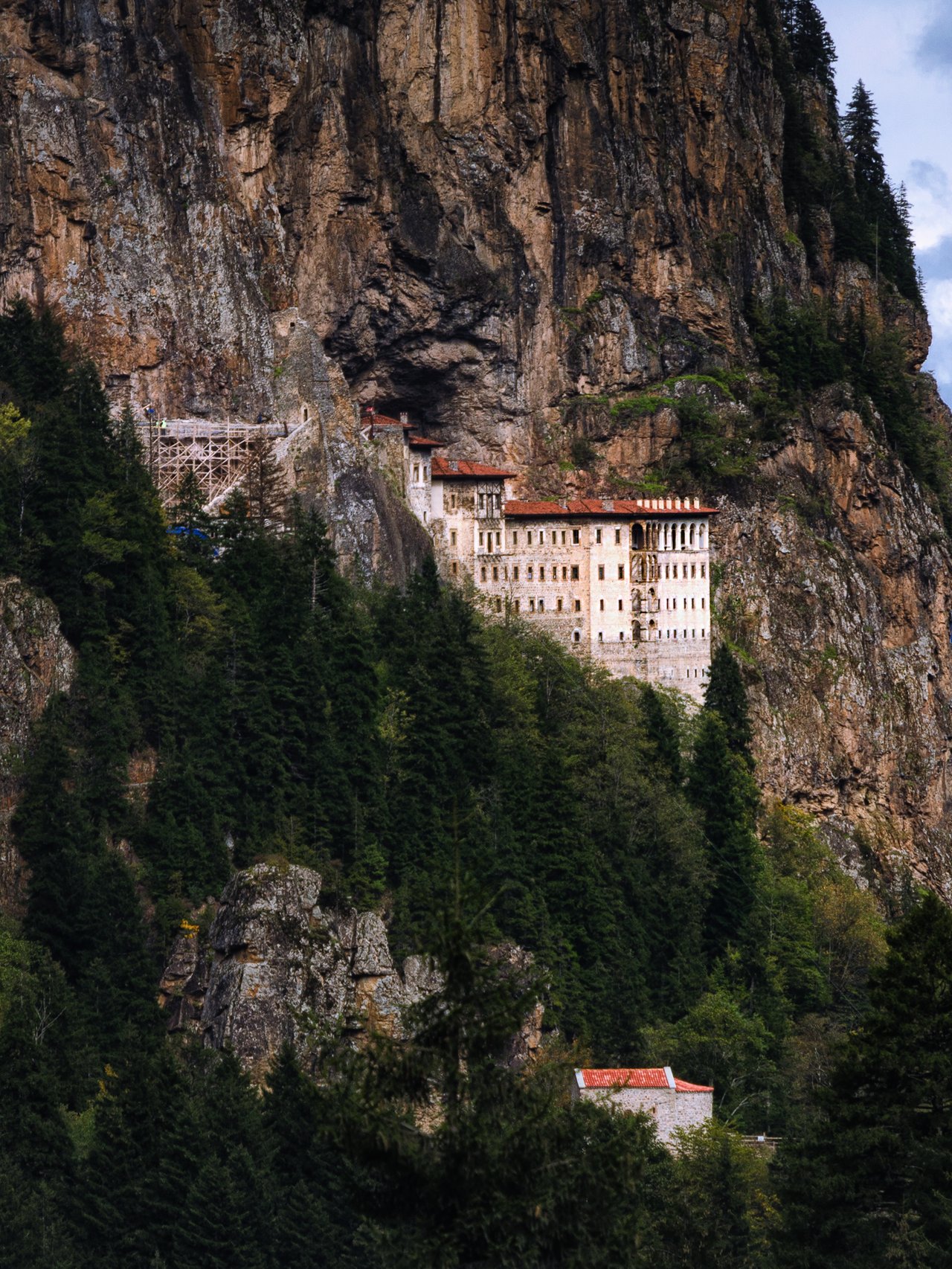 Sumela Monastery tucked into the mountains and surrounded by forest