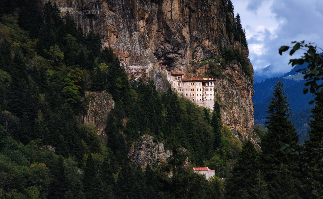 Sumela Monastery tucked into the mountains and surrounded by forest
