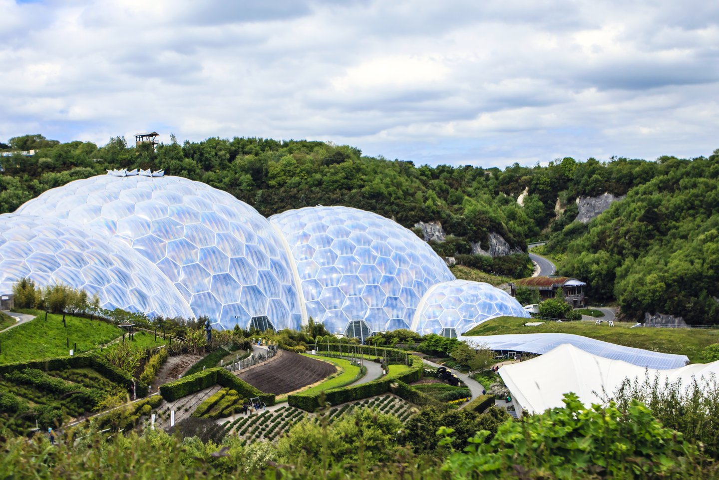 The domes of Eden Project surrounded by gardens in Cornwall, UK 
