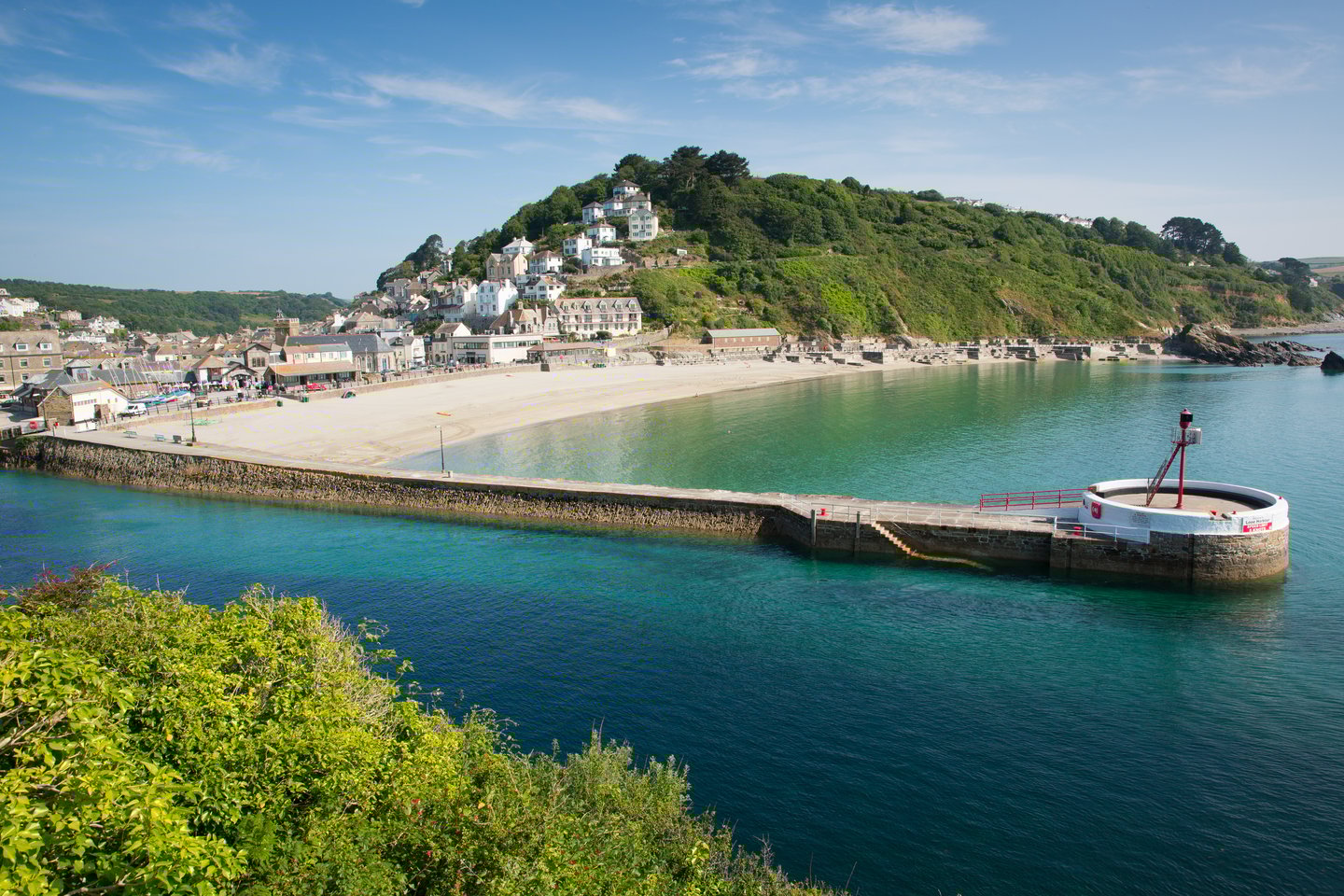 Blue sea on a sunny summer day at Looe harbour in Cornwall, UK