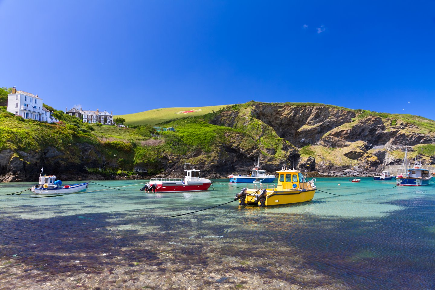 Colourful fishing boats at Port Isaac harbour in Cornwall