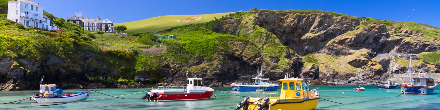 Colourful fishing boats at Port Isaac harbour in Cornwall