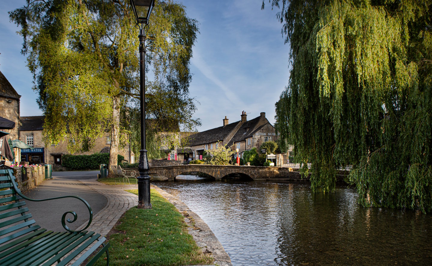 Willow trees and waterways in Bourton-on-the-Water on a sunny day