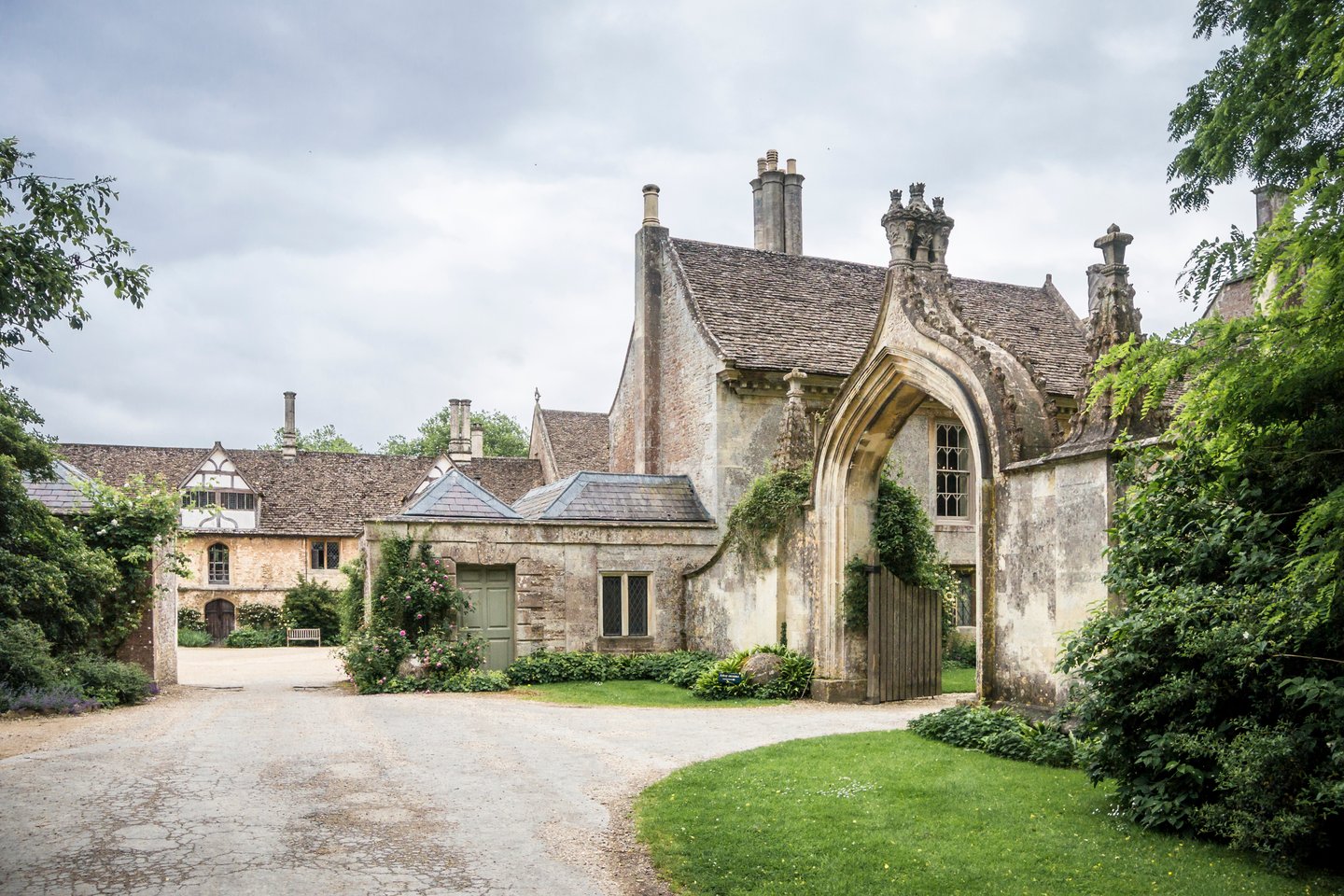 Lacock Abbey in the village of Lacock, Wiltshire, on a cloudy day