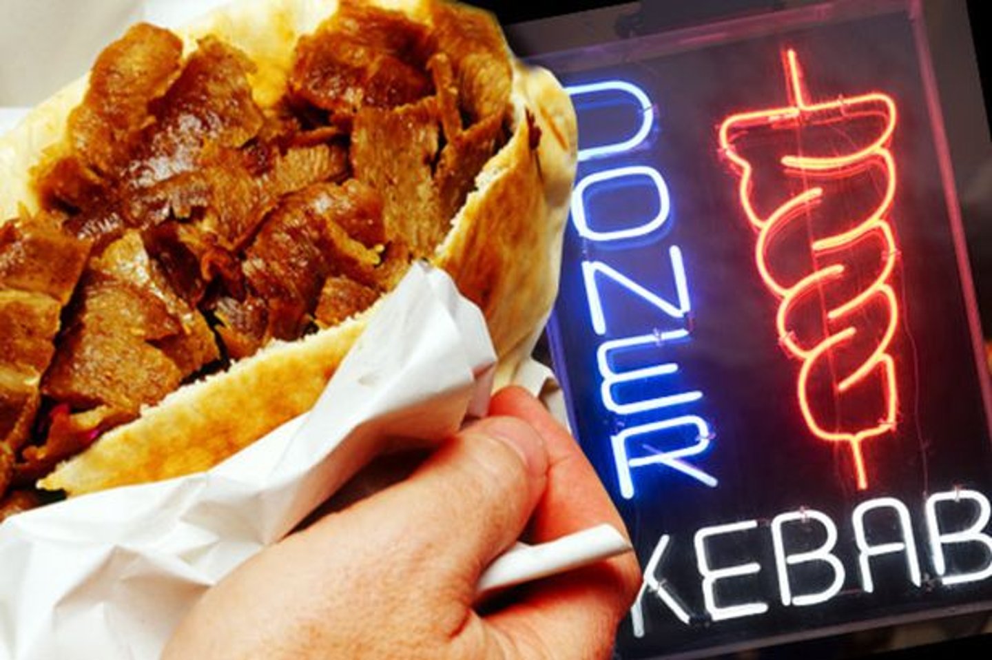 A doner kebab outside a kebab shop at night