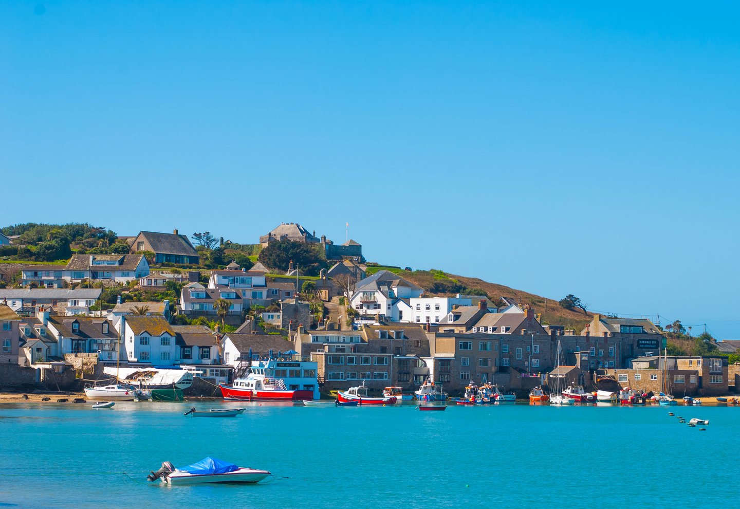 Boats and houses at the harbour of St Mary's, Isles of Scilly