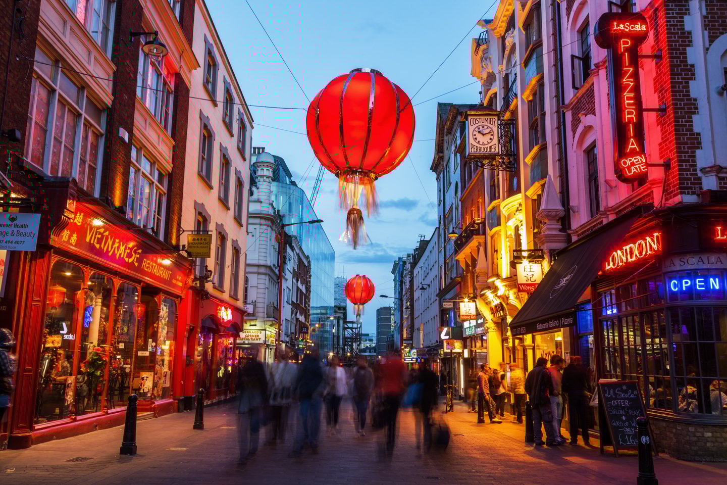 A busy street in London's Chinatown at night