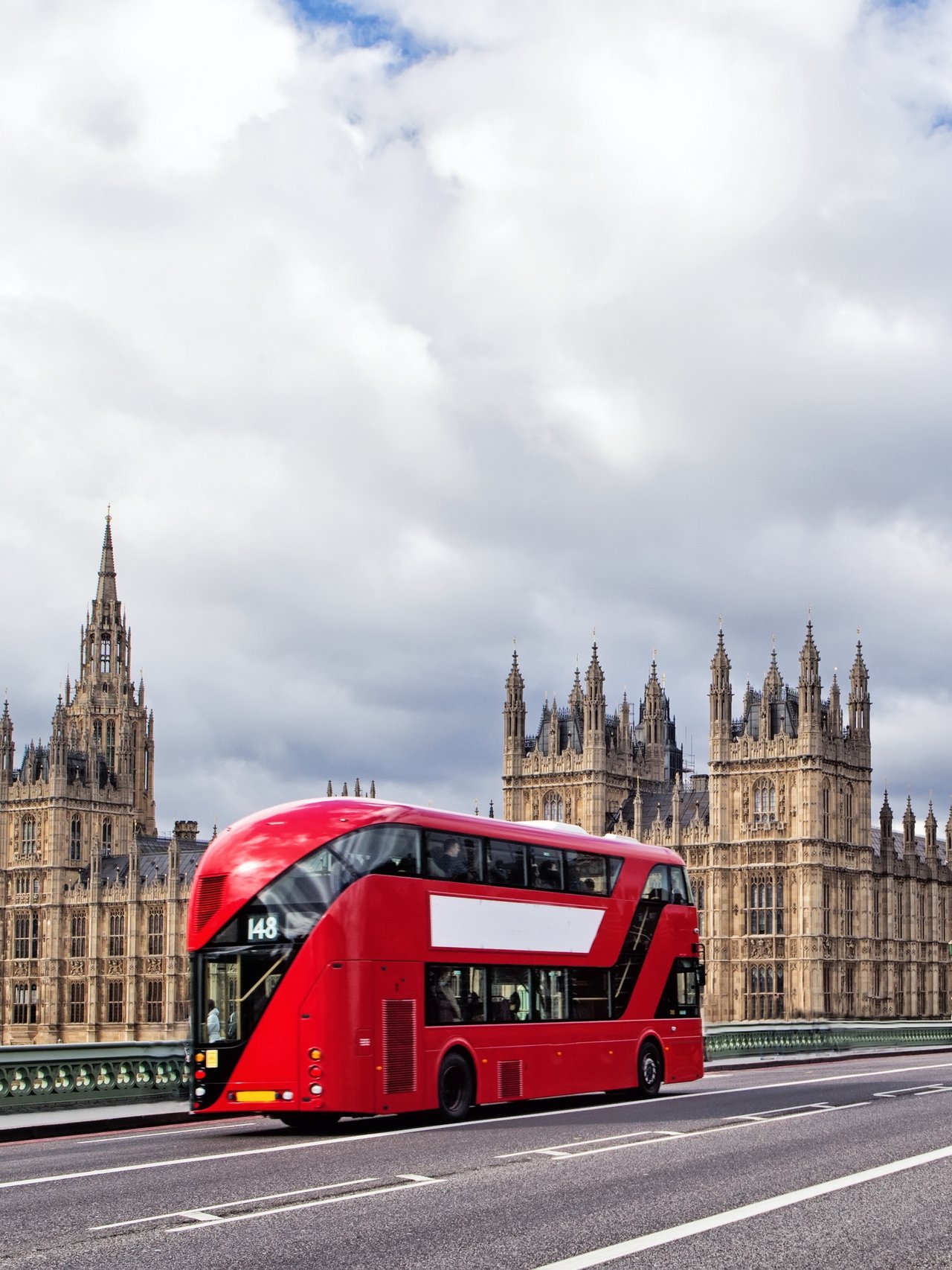 A London bus on Westminster Bridge with the Houses of Parliament and Big Ben in the background