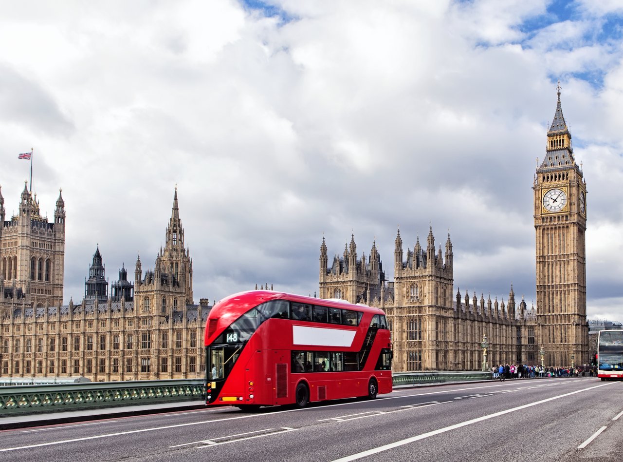 A London bus on Westminster Bridge with the Houses of Parliament and Big Ben in the background