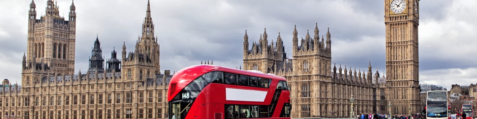 A London bus on Westminster Bridge with the Houses of Parliament and Big Ben in the background