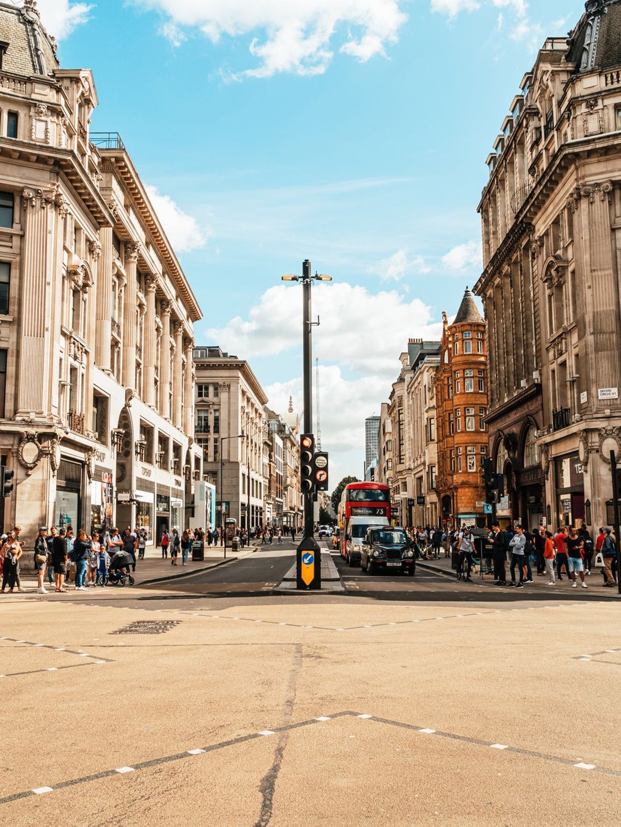 Shops and people at Oxford Circus in London.