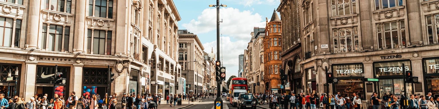 Shops and people at Oxford Circus in London.